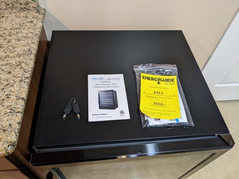 Comes with keys to lock the fridge as well as a manual and note on estimated energy effecient cost to run the fridge.