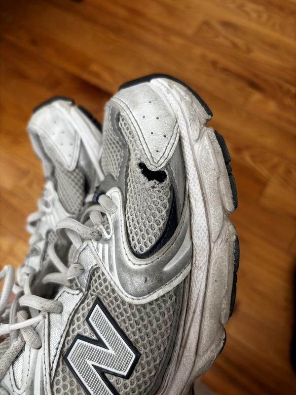 Ripped mesh on both shoes