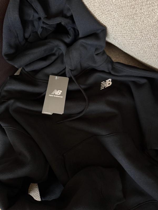 (取寄) ニューバランス レディース スポーツ エッセンシャル フリース ブーディ New Balance women Sport Essentials Fleece Hoodie Black New Balance Women's Sport Essentials Fleece Full Zip, Black