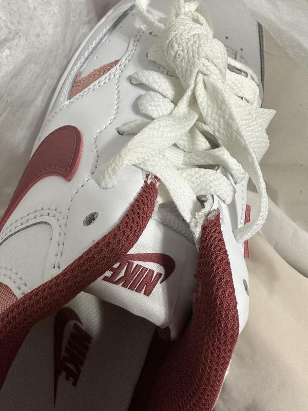 The white fabric isn’t secured well and seems unfinished on both shoes.