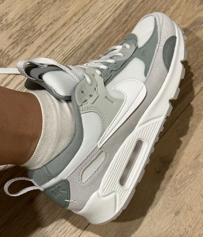 suede part is more of a gray than a light green like in photo