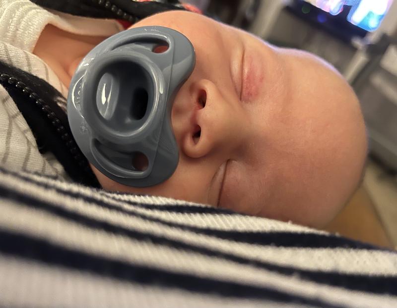 Keeping pacifier store in baby's mouth