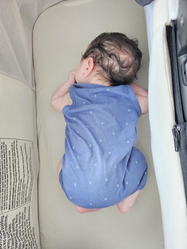 He loves his nuna bassinet.