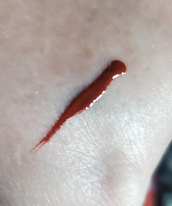 It dries down absolutely, utterly, completely brown. It's terra cotta.