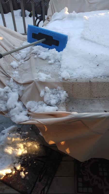 Nice broom for brushing snow off outdoor table.