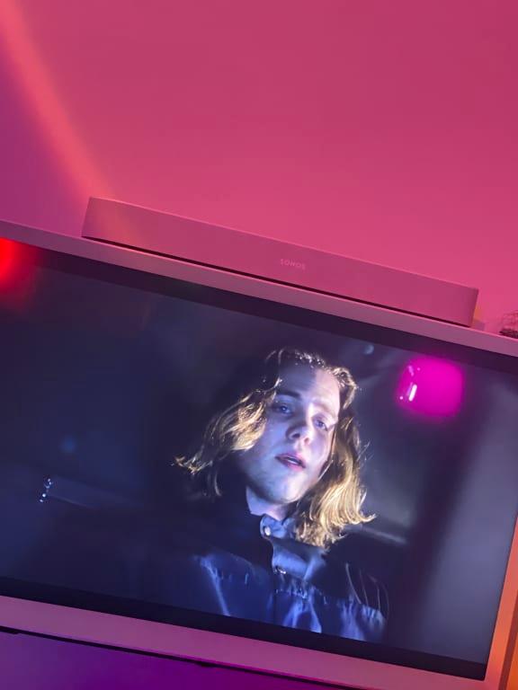 Sonos beam sat on top of the serif tv