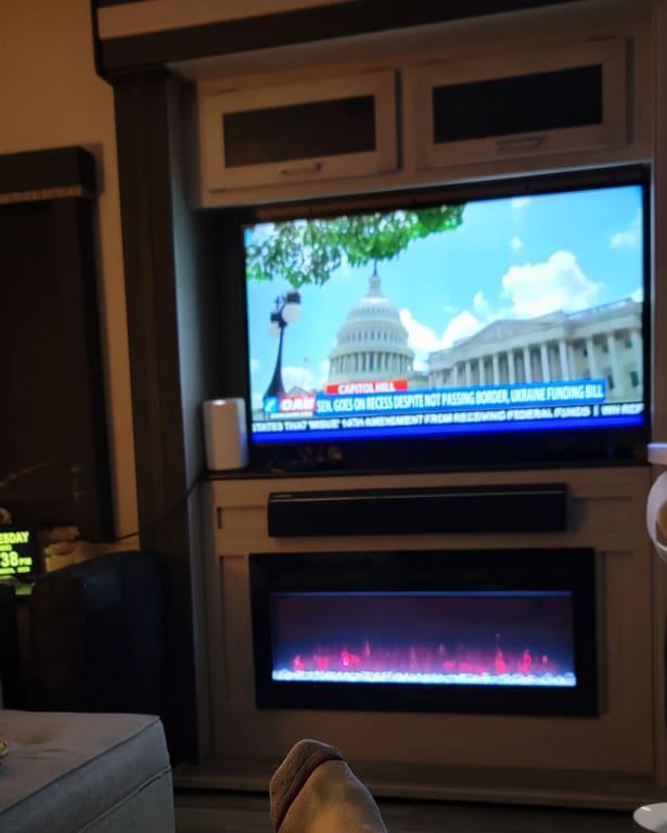 Almost invisible under the tv