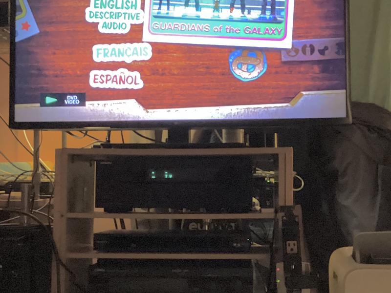 Unit is second on shelf under Tv.