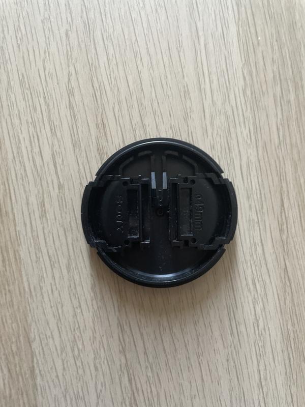 Lens cap after accidental drop from 0.5 meters on road
