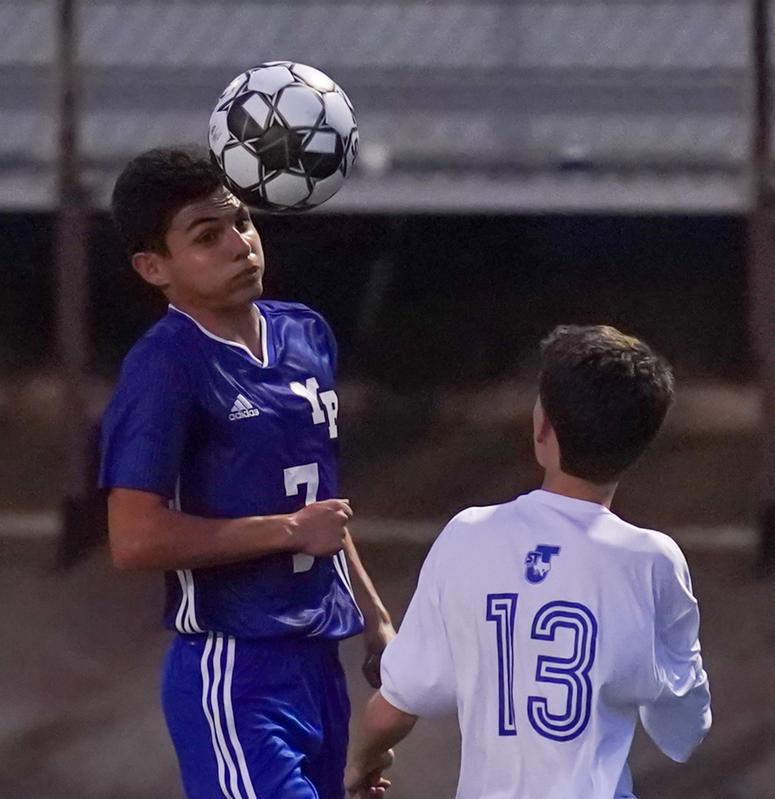 Really love the speed of the lens as the ball is headed off the player in blue...