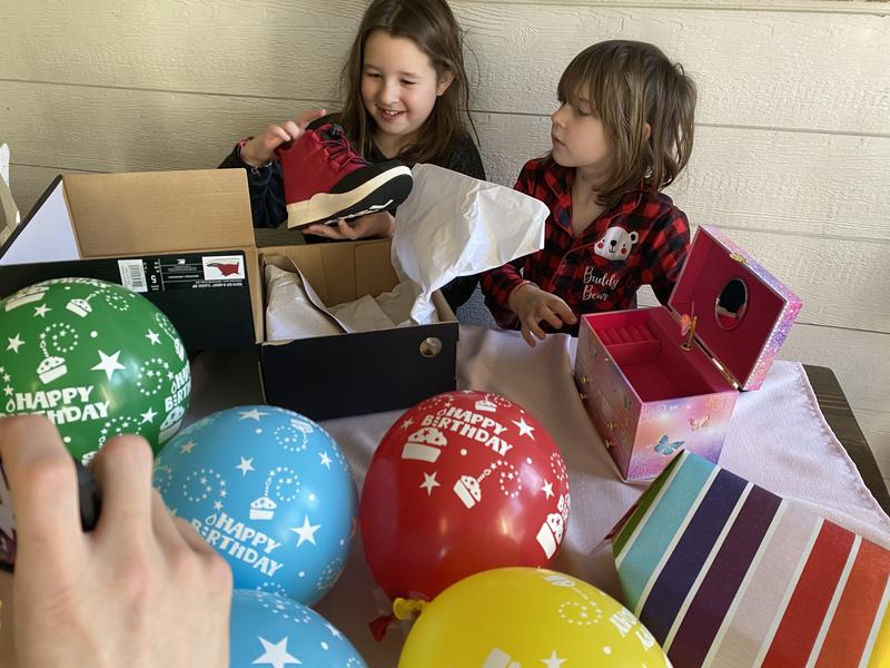 Birthday girl with her sweet new rain boots