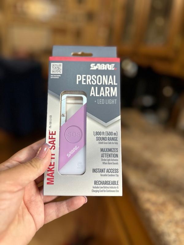 SABRE 2-in-1 Personal Alarm With LED Light & SOS Button 130db Siren Heard From 1 800 Foot 500 Meter Carabiner Clip For Easy Carry On Backpacks Purses Rechargeable With Charging Cord Included