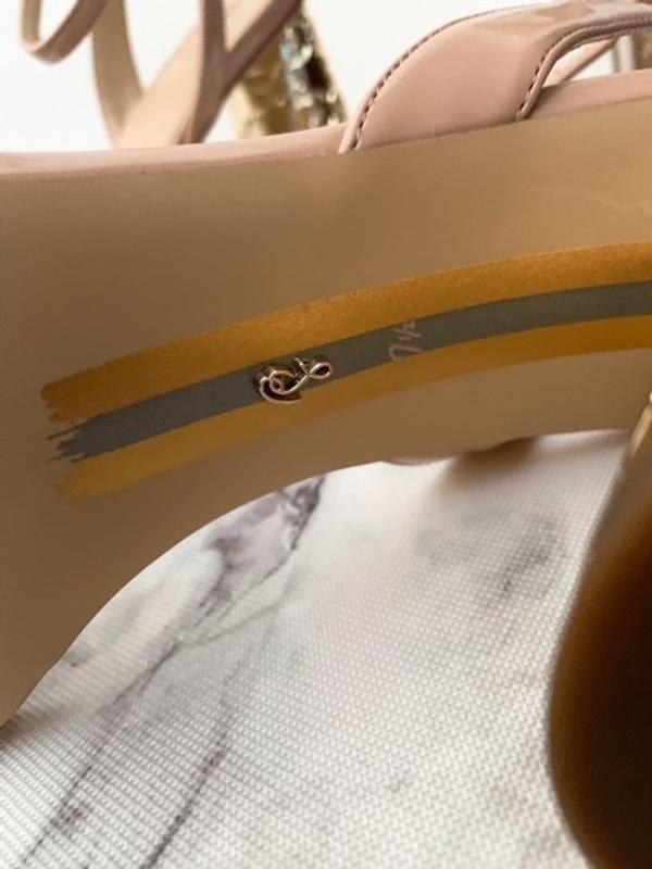 Adorable Signature charm at the bottom of the shoes