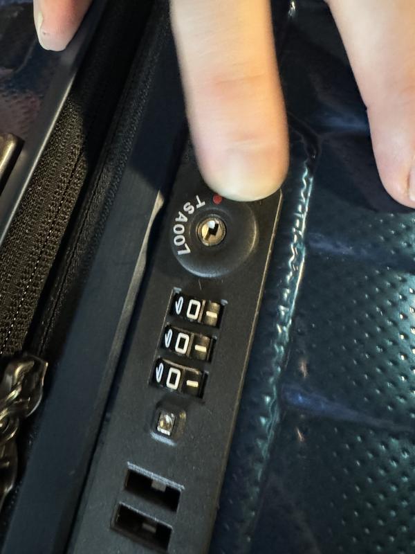 Initial lock code is 000 and you just push the keyhole circle to the side to open