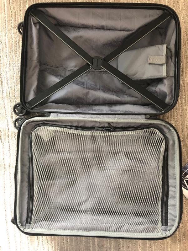 Zipper closure on one side, seatbelt X-design on other