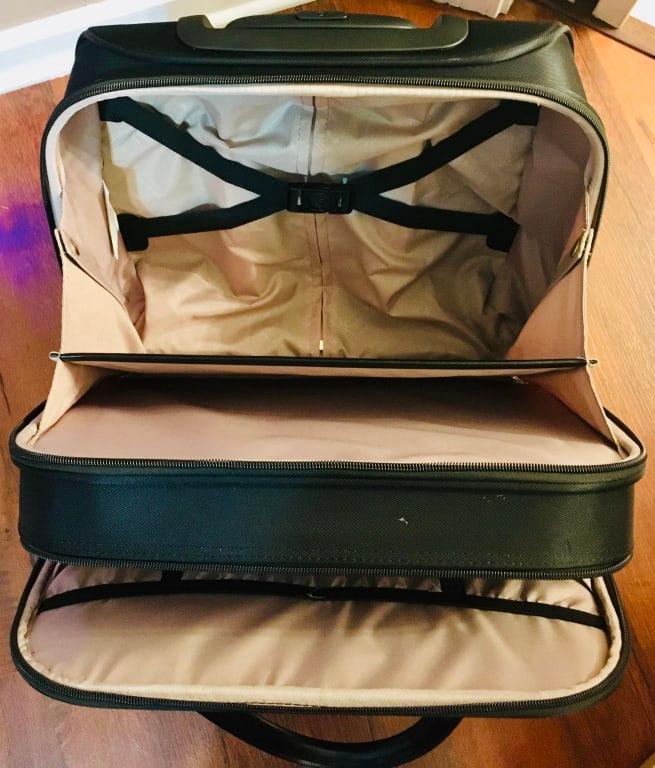 Durable construction Made of water-resistant coated lightweight nylon twill fabric.SmartSleeve on back panel. Fits over most luggage carry handles for hassle-free combination travel. Gold-colored zippers and detailing. Lend to a sophisticated style.