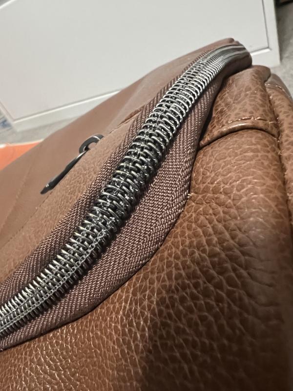 Frayed zipper stitching