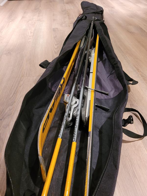 One pair of skis and poles