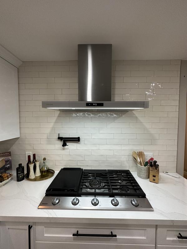 Install your range hood and wall mount vent