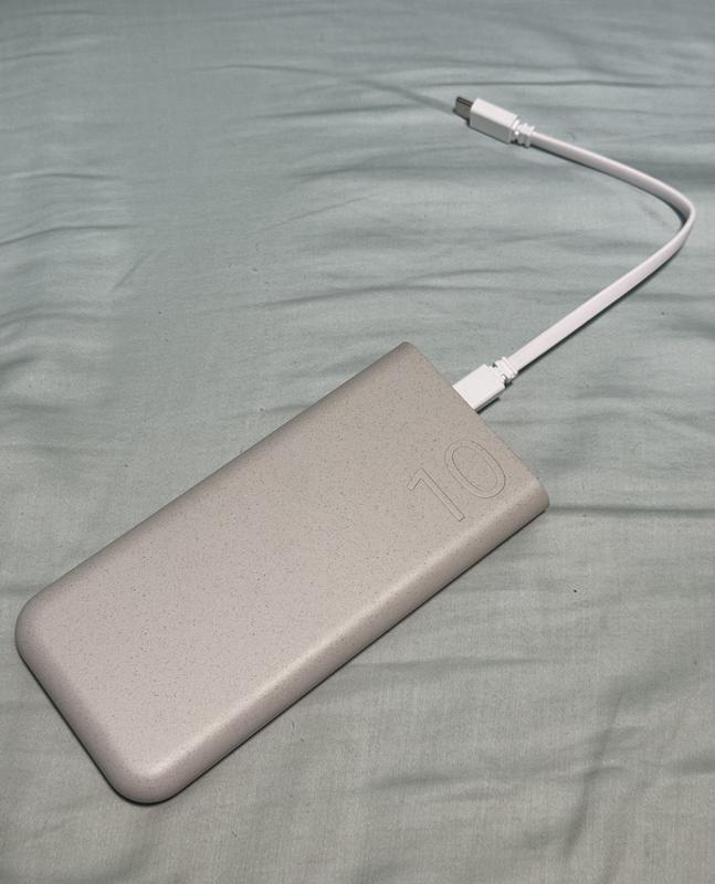 Front of the beige battery pack showing the USB-C to USB-C cable included with the product
