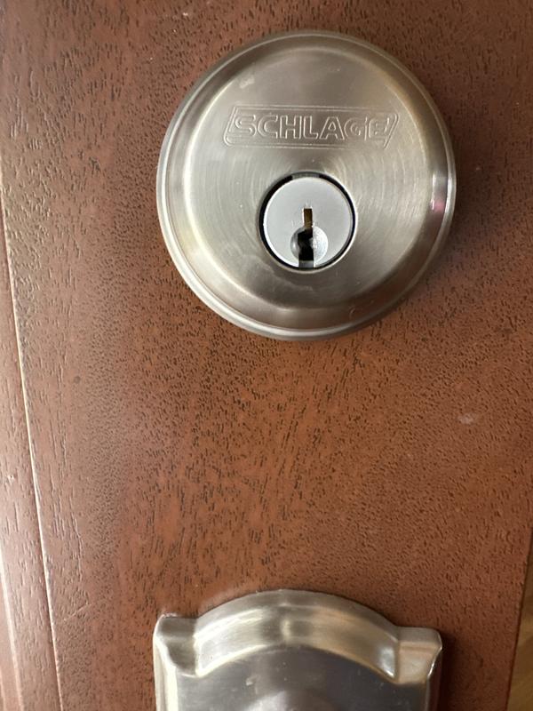 Installed lock - above door handle with backing plate