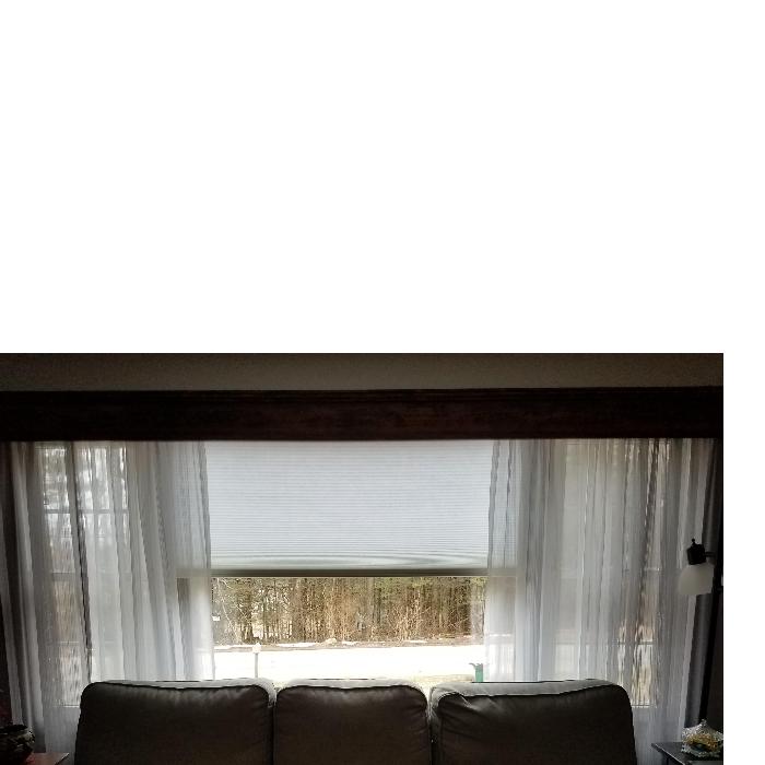 Love the remote control. The shade provides insulation in the cold New England winters and the southwest facing picture window in the summers!