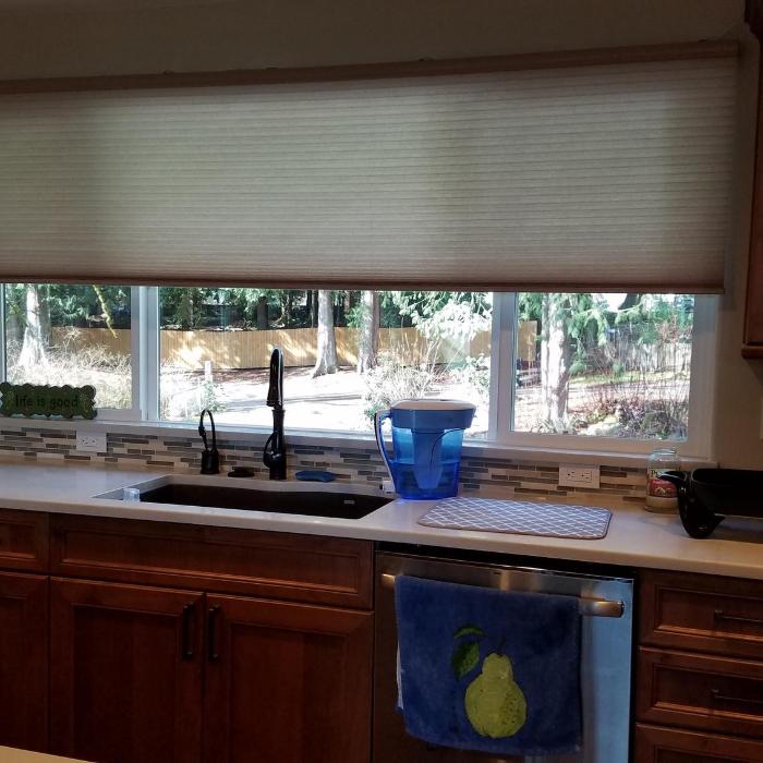 Love our shade in front of the kitchen window.  Let's light in but when down no one outside can see in.