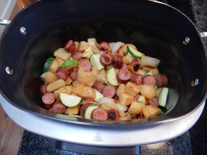 Stir fry/roast potatoes, zucchini, onions and kielbasa
