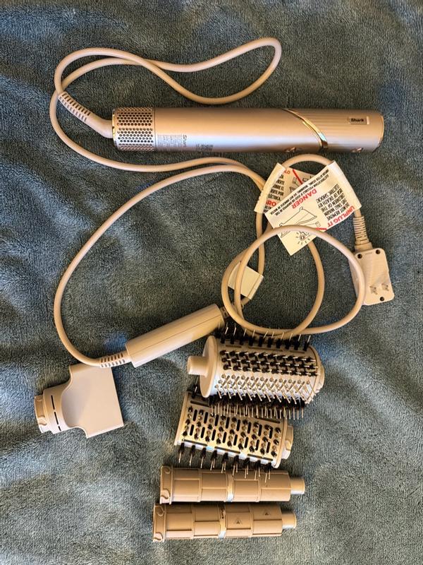 Customer photo for "Absolutely love this hair dryer — so many attachments and amazing results!"