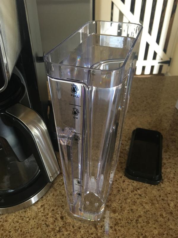 Easy on and off water container clearly marked