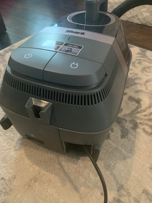 Power button and retraction button for cord