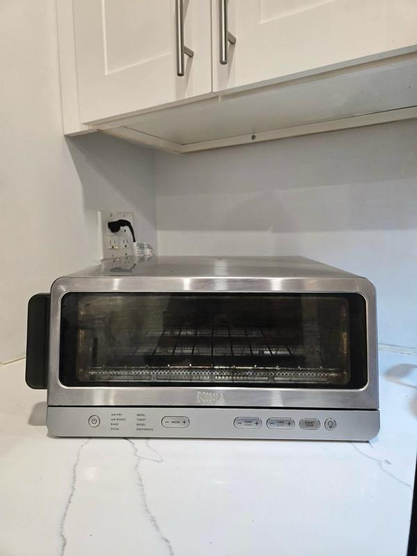 Customer photo for "Love how versatile and easy to use the Ninja Flip Toaster Oven & Air Fryer is—it cooks food quickly and evenly, and the flip-up design saves so much counter space!"