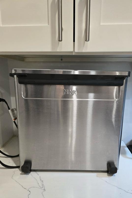 Customer photo for "Love how versatile and easy to use the Ninja Flip Toaster Oven & Air Fryer is—it cooks food quickly and evenly, and the flip-up design saves so much counter space!"