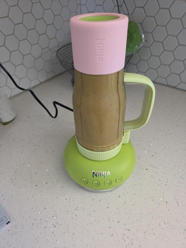 Mixing up spinach leaves, seeds, ice and powder at the same dang time!