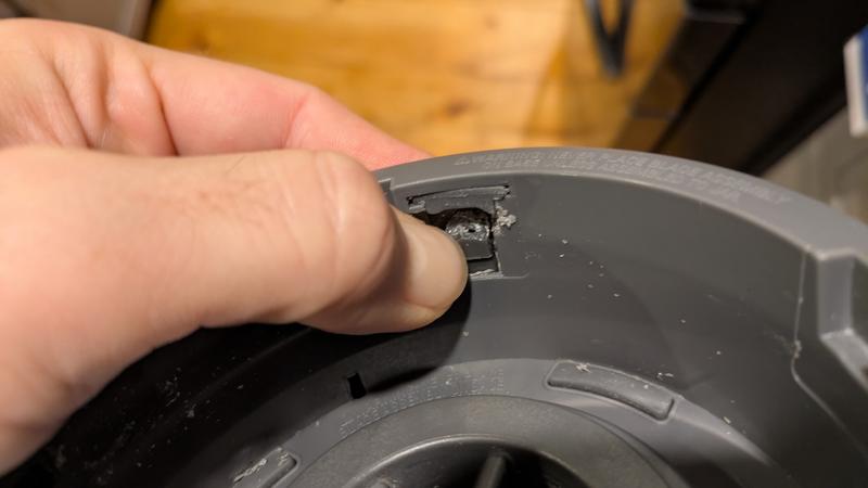 The inner portion where the nubs go into and the trigger that lets the machine run