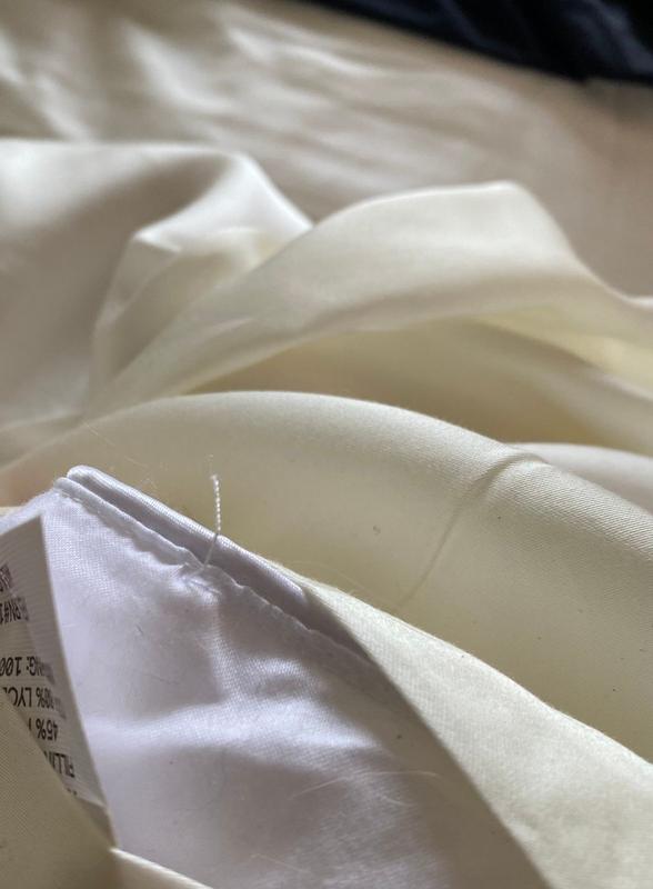 Customer photo for "Less than a week and it’s losing fill and Cotten is fuzzy"