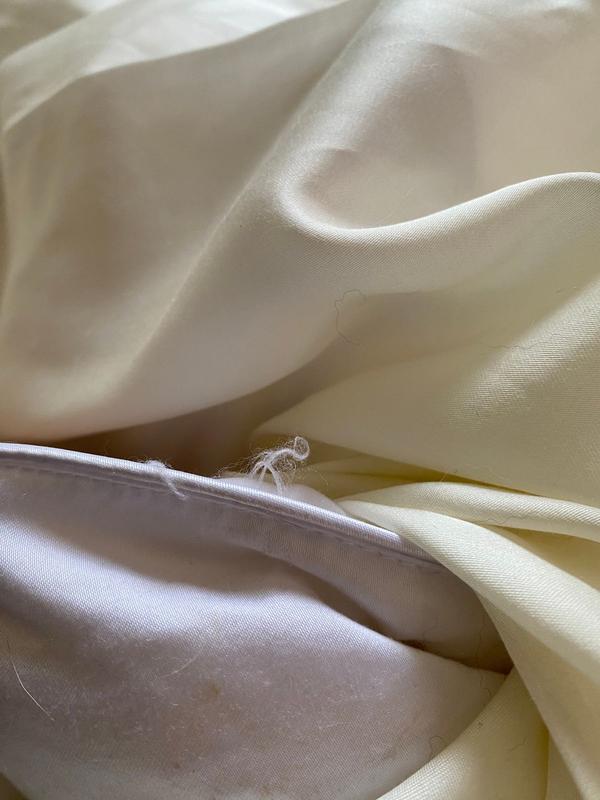 Customer photo for "Less than a week and it’s losing fill and Cotten is fuzzy"