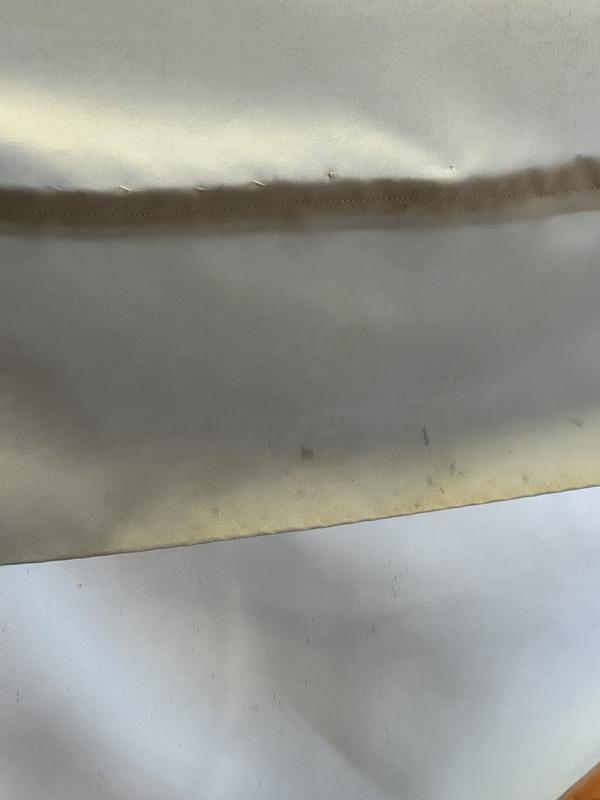 I hemmed a shower curtain that I had tacked up.