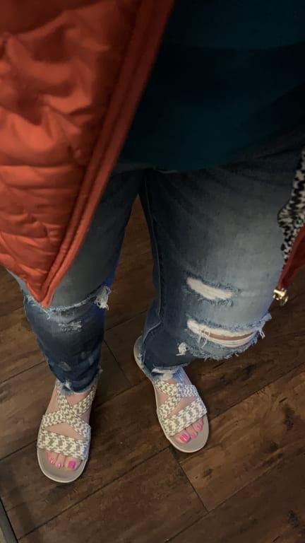 With distressed jeans