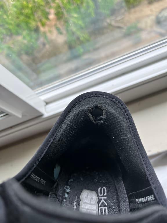 Tear on shoe.