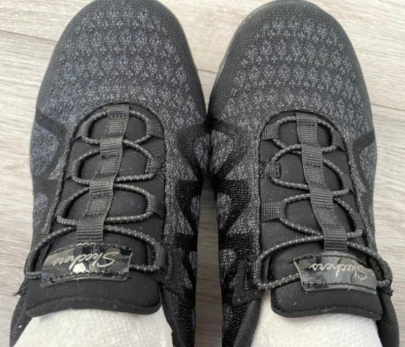 Tongue on the right shoe is improperly sewn