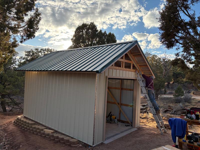 Screwing in the metal siding with the new Skil 12V Driver
