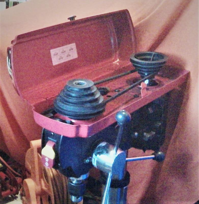 Plastic pulley. Black powdery stuff in drill casing, feels like rubber.