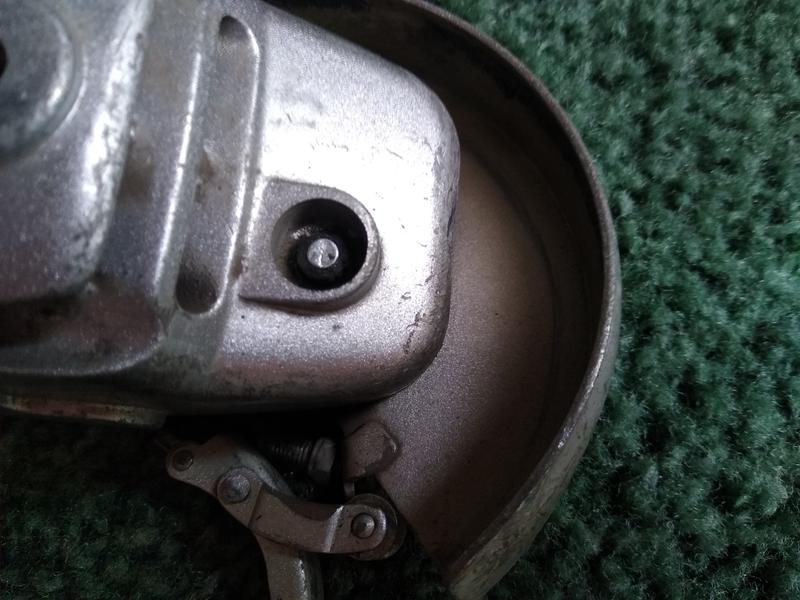 you can see the arbor lock pin in the hole where the button once sat over the spring