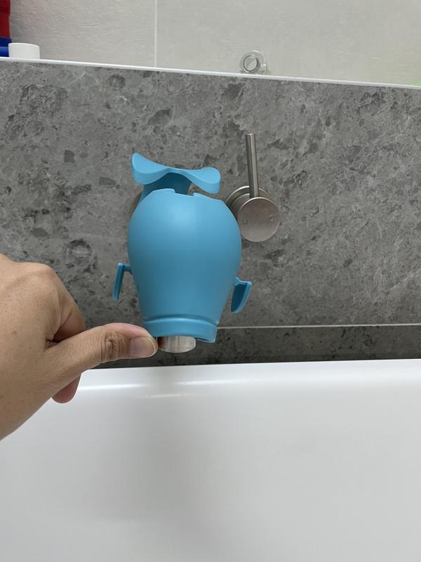 Metal tap exposed when cover pushed upwards from below