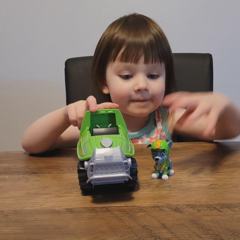 Playing with her new toy