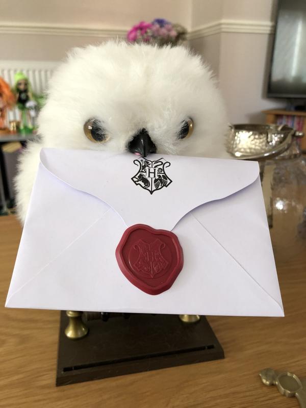 Holding the letter in his mouth