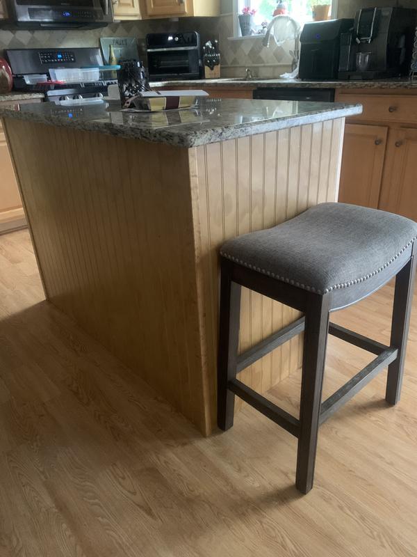 The stool adds character and practicality to our kitchen island.