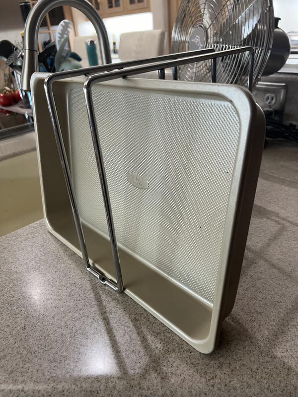 Suggested installation. Holes for screws on bottom. Bars on top limit the size of bakeware you want to store