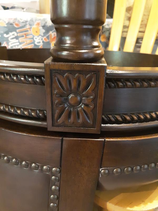 Here is the Maiden Lane Pullman swivel counter stool close-up look the nailhead trim and Fleur De Lis
